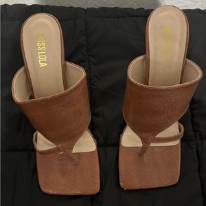 Size 7.5 tan heels. Only worn twice.